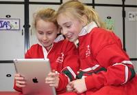 Elsternwick Primary students play on an iPad together