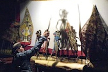 A wayang puppeteer performing
