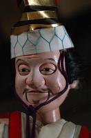 Close-up of the smiling face of a Sanbaso Bunraku puppet