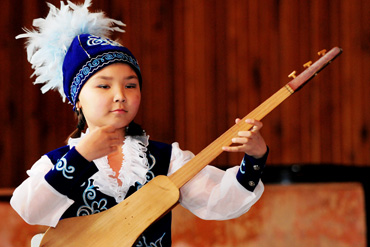  Student playing traditional Vietnamese musical instrument