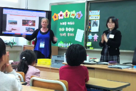 An Australian and Korean teacher lead a class on Korean language together