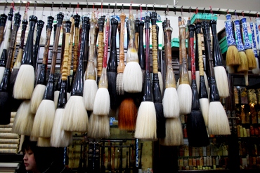 Brushes for sale at market stall