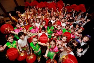 Australian children in costume with red lanterns