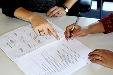 Two women working collaboratively on a document