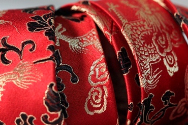 Red Japanese silk tie embroidered with gold stitching