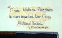 Gross National Happiness slogan on the wall of a Bhutan school