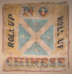 An old banner encouraging people to protest during the Gold Rush against Chinese immigrants