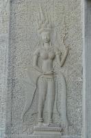 Bas-relief of an Angkor dancer wearing an ornate headdress and jewellry