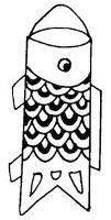 Decorated tube with scales and eyes to look like a carp. A string is attached at opposite end to the 'V' cut.