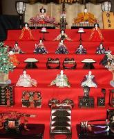 Seven rows of displayed Japanese dolls