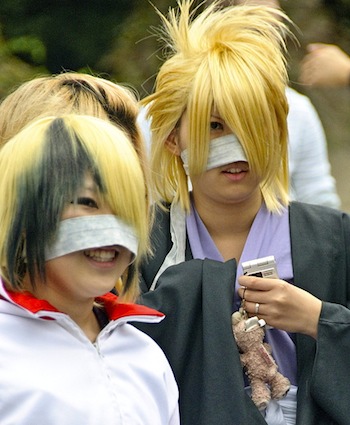 Japanese teenagers with bleached hair wearing fabric nose masks