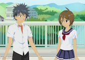 Screenshot of an anime cartoon of a young boy and girl talking together