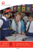 Australian teacher explaining a lesson to two Indian teachers