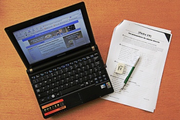 A laptop and an language exercise booklet